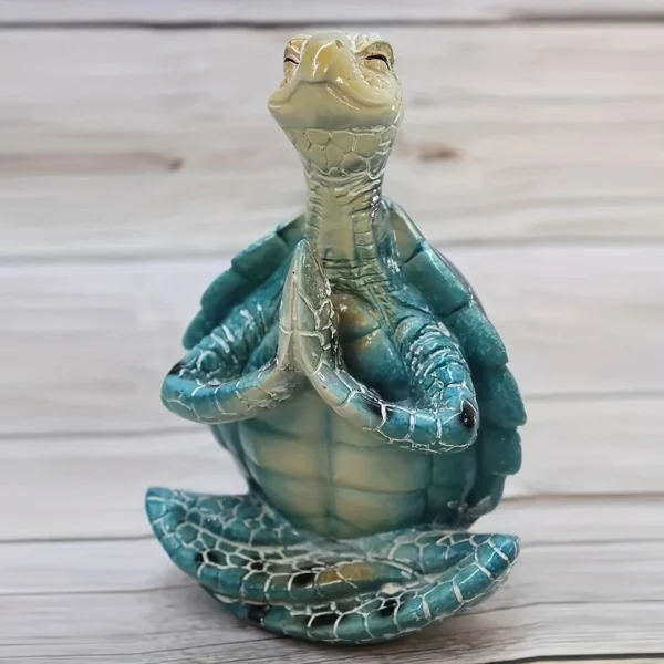 Une tortue en méditation, statue évoquant la paix et la sagesse, parfaite pour un coin zen ou un jardin.
