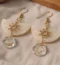 Boucles d'oreilles soleil et acétate